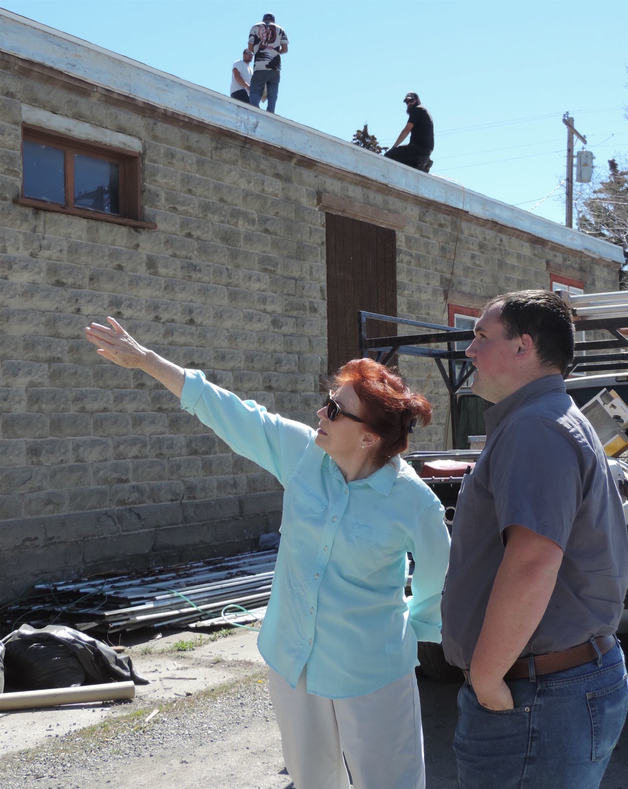 margie van orden discusses roof with tim rice